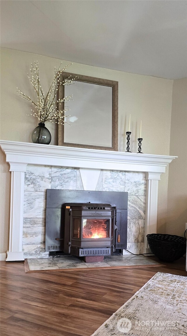 3435 Auburn Way S Unit 15, Auburn, WA 98092 - detailed view of wood finished floors, a wood stove, and baseboards
