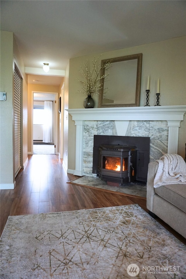3435 Auburn Way S Unit 15, Auburn, WA 98092 - living room with wood finished floors, baseboards, and a fireplace