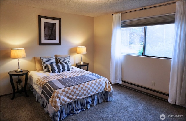 3435 Auburn Way S Unit 15, Auburn, WA 98092 - bedroom featuring a baseboard heating unit, carpet flooring, and a textured ceiling