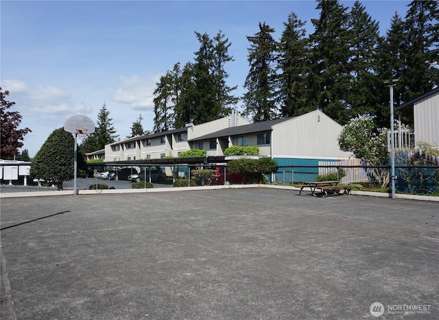 3435 Auburn Way S Unit 15, Auburn, WA 98092 - view of front of home with fence, covered parking, and community basketball court