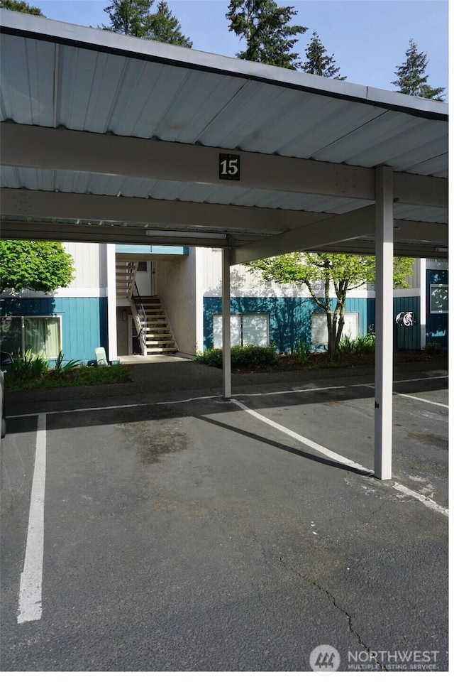 3435 Auburn Way S Unit 15, Auburn, WA 98092 - covered parking lot featuring stairs and fence