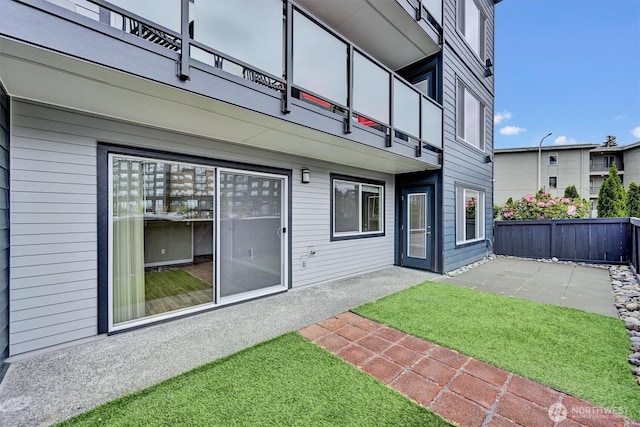 1175 Harrington Pl NE Unit 101, Renton, WA 98056 - rear view of property featuring fence, a patio, and a balcony