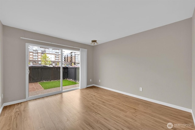 1175 Harrington Pl NE Unit 101, Renton, WA 98056 - unfurnished room featuring wood finished floors and baseboards
