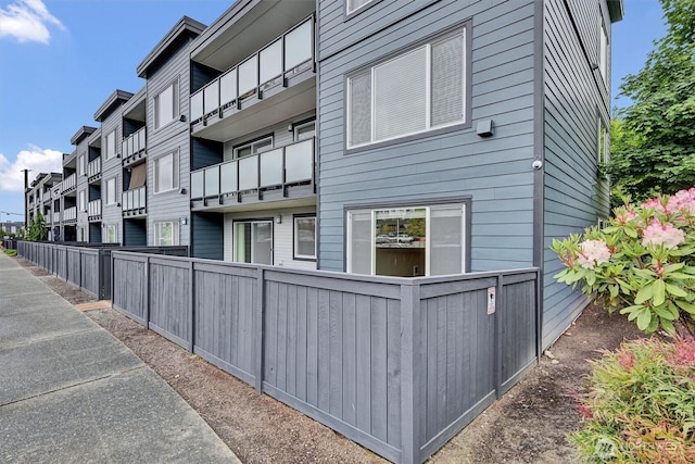 1175 Harrington Pl NE Unit 101, Renton, WA 98056 - view of building exterior with fence