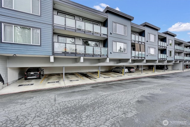 1175 Harrington Pl NE Unit 101, Renton, WA 98056 - view of property featuring covered parking