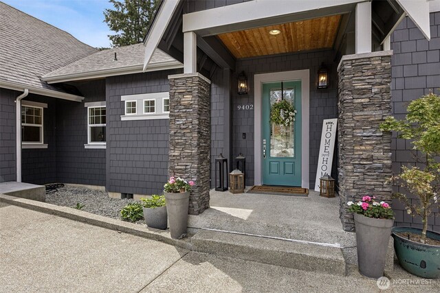 9402 72nd Ave E, Puyallup, WA 98371 - doorway to property featuring roof with shingles