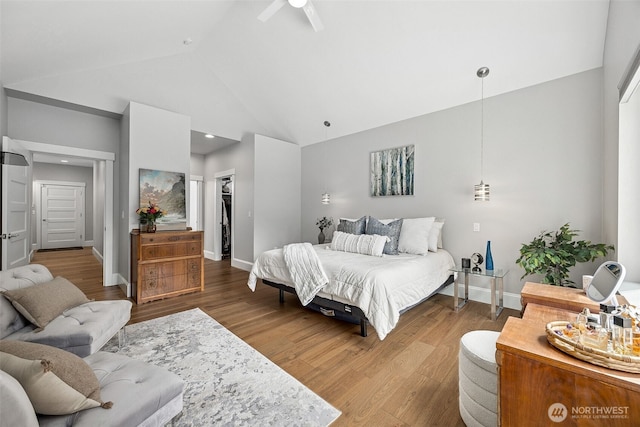 9402 72nd Ave E, Puyallup, WA 98371 - bedroom with high vaulted ceiling, wood finished floors, a spacious closet, baseboards, and a closet