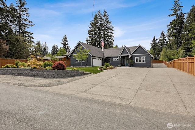 9402 72nd Ave E, Puyallup, WA 98371 - craftsman house featuring a garage, fence, and driveway