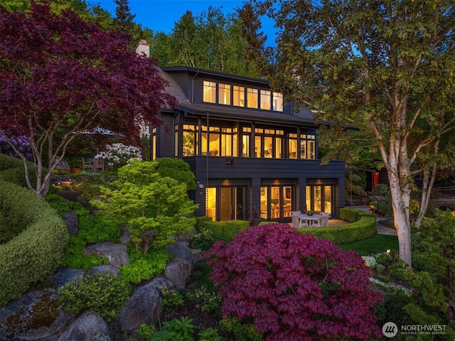 10208 47th Ave SW, Seattle, WA 98146 - back of property featuring french doors, a chimney, and a patio