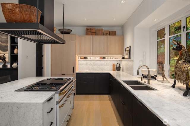 10208 47th Ave SW, Seattle, WA 98146 - kitchen featuring island range hood, a sink, light stone counters, light wood-style flooring, and recessed lighting