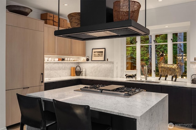 10208 47th Ave SW, Seattle, WA 98146 - kitchen with custom range hood, modern cabinets, stainless steel gas cooktop, a center island, and ornamental molding