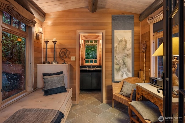 10208 47th Ave SW, Seattle, WA 98146 - living area with wood walls, tile patterned floors, and wood ceiling