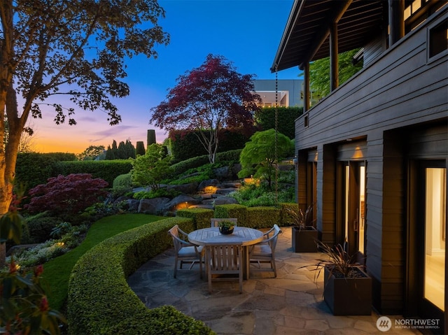 10208 47th Ave SW, Seattle, WA 98146 - patio terrace at dusk with outdoor dining space