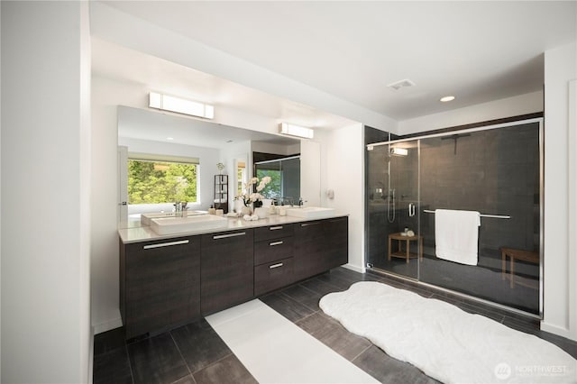 12421 Harwood Cove Ln SW, Lakewood, WA 98498 - bathroom with double vanity, a shower stall, baseboards, wood tiled floors, and recessed lighting
