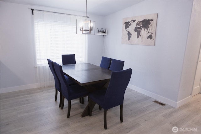 21833 127th Ave SE, Snohomish, WA 98296 - dining room featuring a chandelier, light wood-style floors, and baseboards