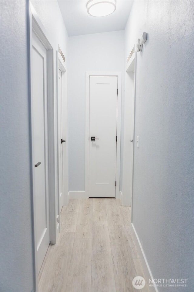 21833 127th Ave SE, Snohomish, WA 98296 - corridor featuring light wood-style floors and baseboards