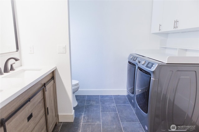 21833 127th Ave SE, Snohomish, WA 98296 - laundry area featuring independent washer and dryer, baseboards, and dark tile patterned floors