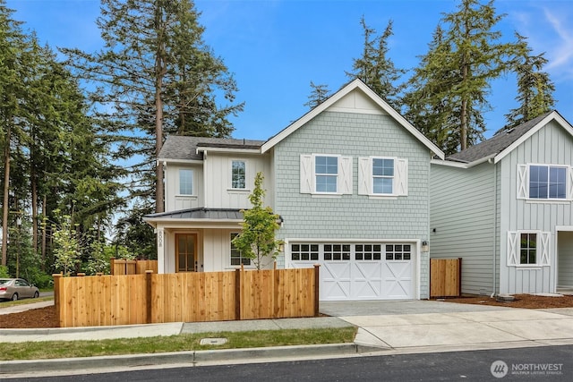 8008 222nd St SW, Edmonds, WA 98026 - view of front of house featuring concrete driveway, fence, board and batten siding, and roof with shingles