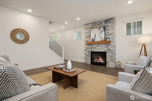 8008 222nd St SW, Edmonds, WA 98026 - living area with wood finished floors, recessed lighting, stairs, baseboards, and a stone fireplace