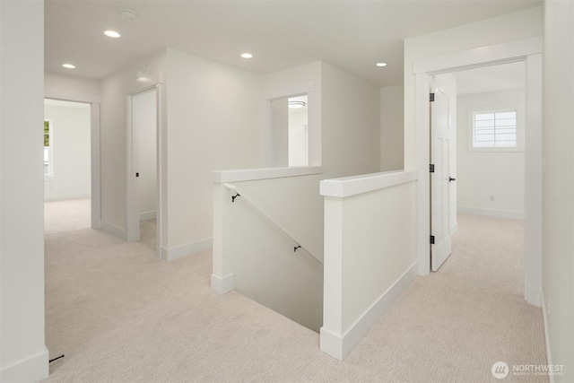 8008 222nd St SW, Edmonds, WA 98026 - corridor with an upstairs landing, light carpet, baseboards, and recessed lighting
