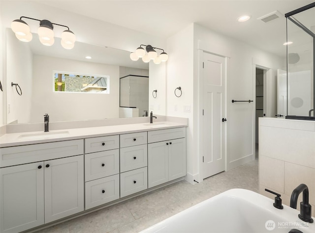 8008 222nd St SW, Edmonds, WA 98026 - bathroom featuring a stall shower, double vanity, recessed lighting, and a bathtub