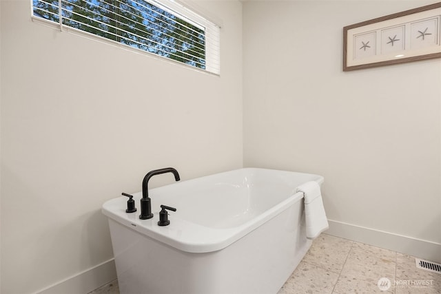8008 222nd St SW, Edmonds, WA 98026 - full bath with baseboards and a freestanding tub