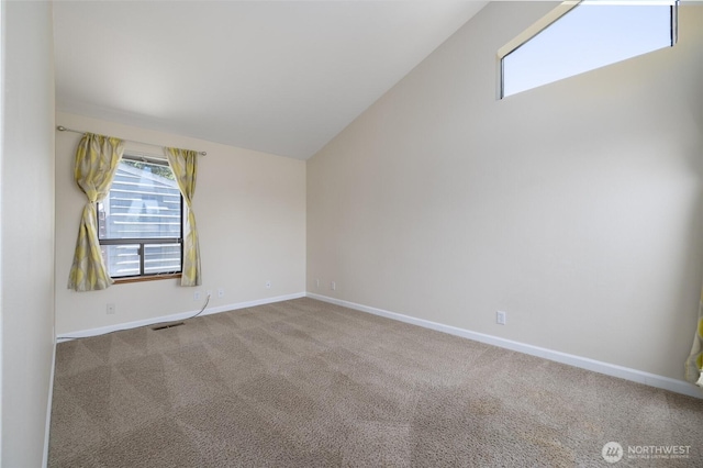 87 Swinomish Dr, La Conner, WA 98257 - carpeted spare room with vaulted ceiling and baseboards
