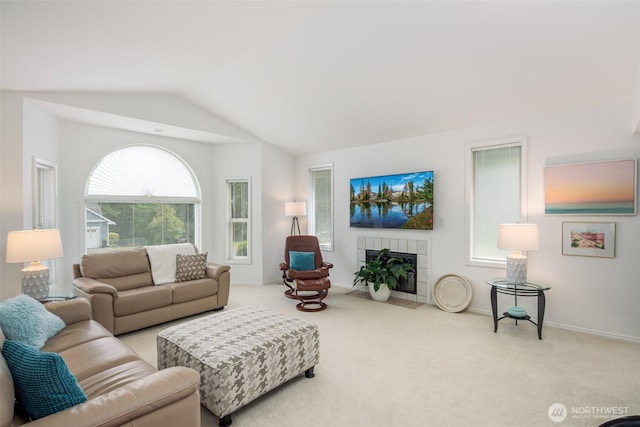 805 E Pacificview Dr, Bellingham, WA 98229 - carpeted living area featuring vaulted ceiling, a tile fireplace, and baseboards