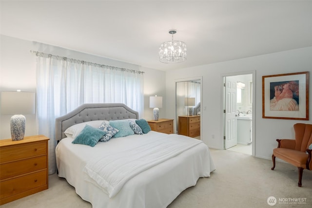 805 E Pacificview Dr, Bellingham, WA 98229 - bedroom with light carpet, a chandelier, a sink, and ensuite bath