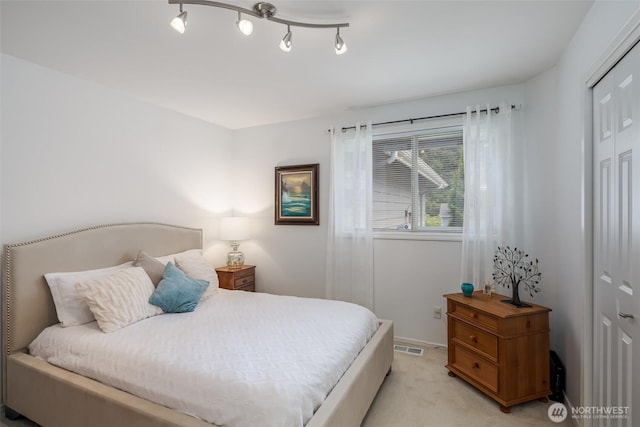 805 E Pacificview Dr, Bellingham, WA 98229 - bedroom with a closet and light colored carpet