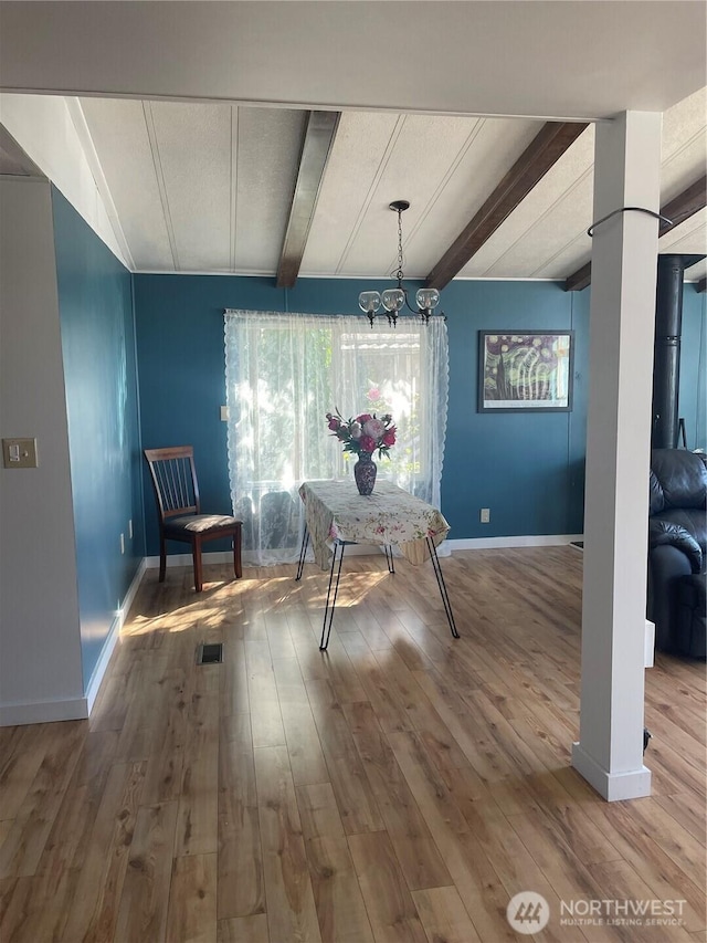 3001 S 288th St Unit 344, Federal Way, WA 98003 - dining area with beamed ceiling, plenty of natural light, wood finished floors, and a chandelier