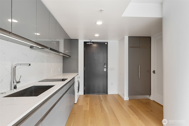 1808 Minor Ave Unit 301, Seattle, WA 98101 - kitchen with modern cabinets, a sink, gray cabinetry, light wood-style floors, and recessed lighting