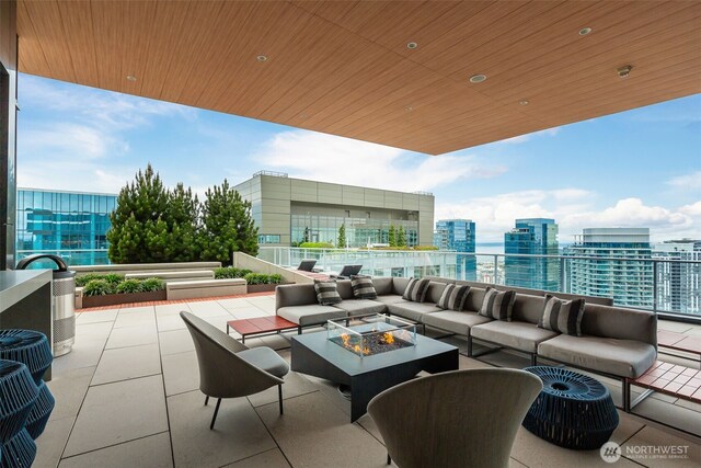 1808 Minor Ave Unit 301, Seattle, WA 98101 - view of patio with an outdoor living space with a fire pit