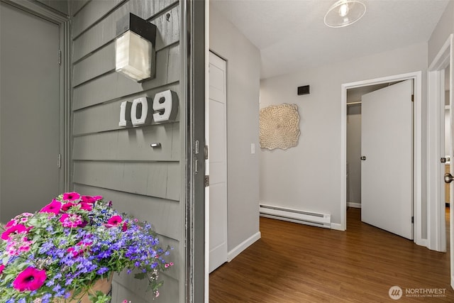7 Lake Bellevue Dr Unit 109, Bellevue, WA 98005 - detailed view of a baseboard radiator, wood finished floors, and baseboards