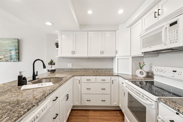 7 Lake Bellevue Dr Unit 109, Bellevue, WA 98005 - kitchen with white appliances, a sink, dark wood finished floors, white cabinets, and recessed lighting