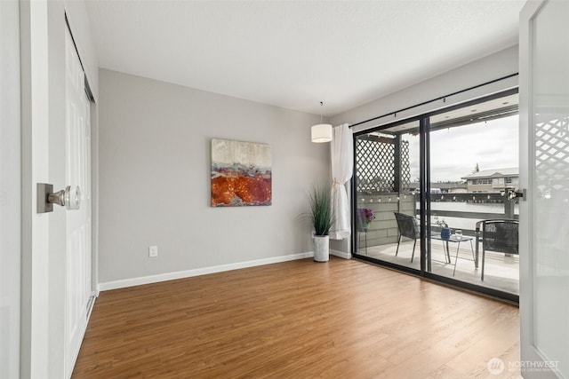 7 Lake Bellevue Dr Unit 109, Bellevue, WA 98005 - unfurnished room featuring wood finished floors and baseboards