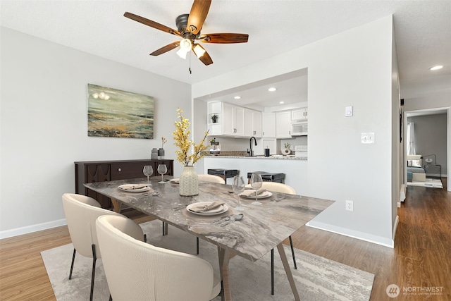 7 Lake Bellevue Dr Unit 109, Bellevue, WA 98005 - dining space with baseboards, a ceiling fan, light wood-style floors, and recessed lighting