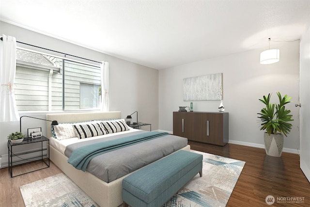 7 Lake Bellevue Dr Unit 109, Bellevue, WA 98005 - bedroom with a baseboard heating unit, wood finished floors, and baseboards
