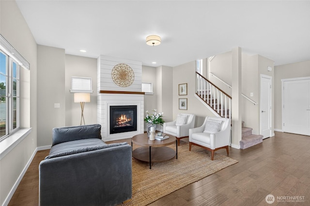 704 Springside Ln, Bellingham, WA 98226 - living area with stairway, a large fireplace, dark wood-type flooring, plenty of natural light, and recessed lighting