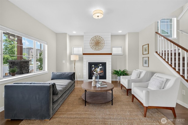704 Springside Ln, Bellingham, WA 98226 - living area with plenty of natural light, a large fireplace, wood finished floors, stairway, and recessed lighting