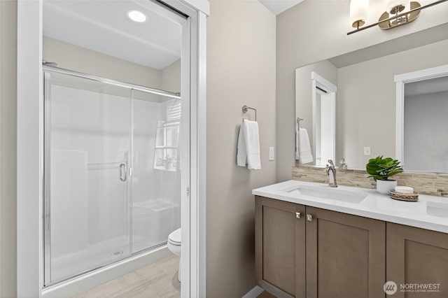 704 Springside Ln, Bellingham, WA 98226 - full bath featuring a shower stall, double vanity, decorative backsplash, and recessed lighting