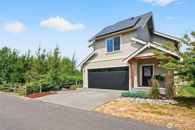 704 Springside Ln, Bellingham, WA 98226 - view of front of property featuring an attached garage, solar panels, and driveway