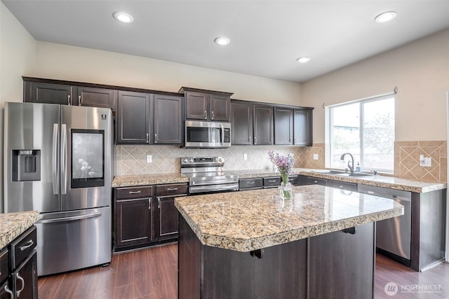 18509 11th Ln E, Spanaway, WA 98387 - kitchen featuring appliances with stainless steel finishes, a sink, dark wood finished floors, dark brown cabinetry, and recessed lighting
