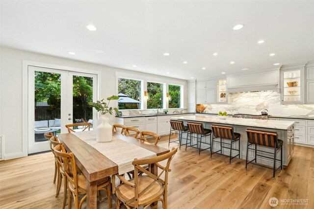 26817 SE 9th Way, Sammamish, WA 98075 - dining space with plenty of natural light, recessed lighting, light wood-type flooring, and french doors