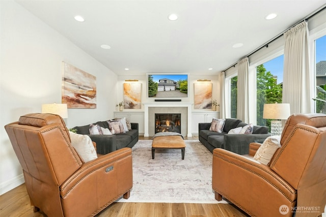 26817 SE 9th Way, Sammamish, WA 98075 - living room featuring healthy amount of natural light, light wood-style floors, recessed lighting, a fireplace, and baseboards