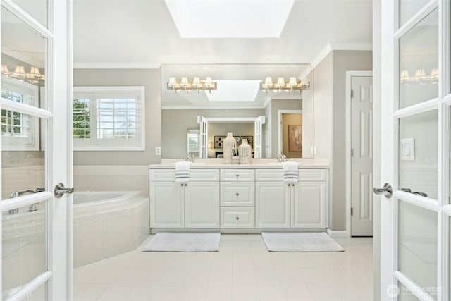 26817 SE 9th Way, Sammamish, WA 98075 - bathroom featuring a chandelier, crown molding, double vanity, a garden tub, and tile patterned floors