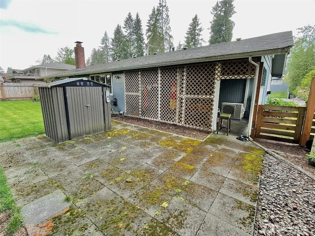 517 W St SE, Tumwater, WA 98501 - back of property with a storage shed, an outbuilding, and a patio area