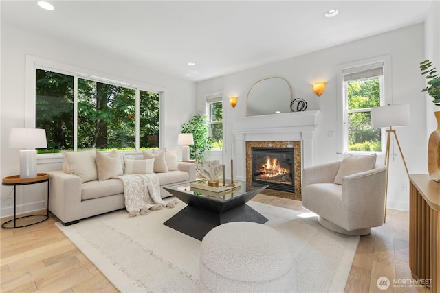 22309 1st Dr SE, Bothell, WA 98021 - living room featuring plenty of natural light, a premium fireplace, recessed lighting, and light wood-style flooring