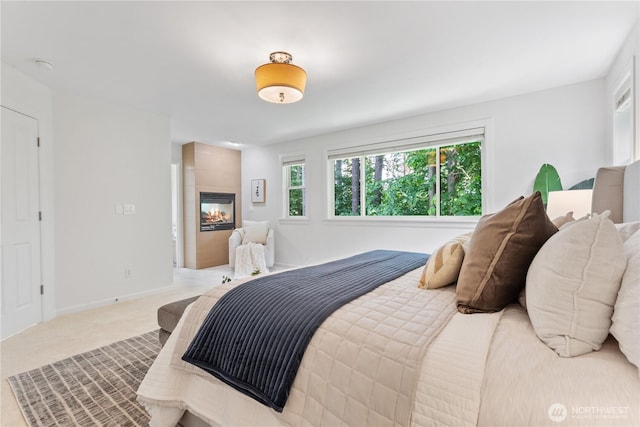 22309 1st Dr SE, Bothell, WA 98021 - carpeted bedroom featuring a multi sided fireplace and baseboards