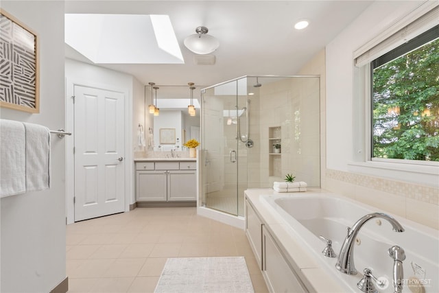 22309 1st Dr SE, Bothell, WA 98021 - bathroom with a skylight, a stall shower, a whirlpool tub, vanity, and tile patterned floors
